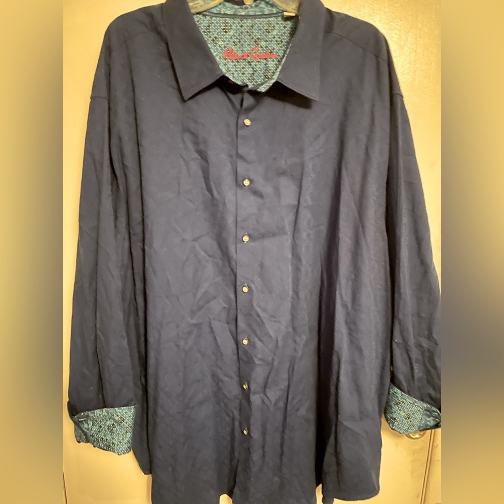 Long sleeve button down shirt with embellished cuffs.